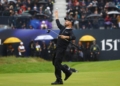 Golf - The 151st Open Championship - Royal Liverpool, Hoylake, Britain - July 23, 2023 Brian Harman of the U.S. throws his ball as celebrates on the 18th green after winning the 151st Open Championship REUTERS/Paul Childs     TPX IMAGES OF THE DAY